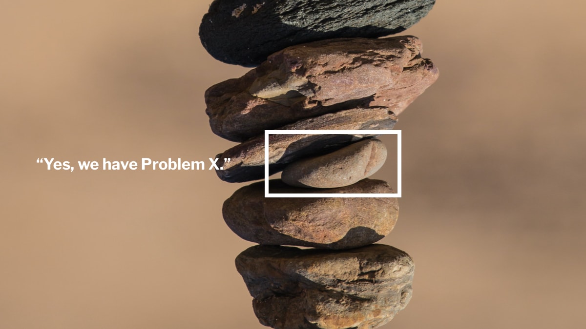 Stack of rocks with a certain rock highlighted